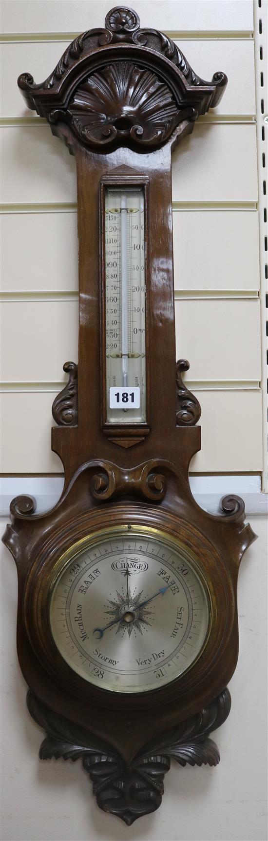 An Edwardian carved aneroid barometer 88cm